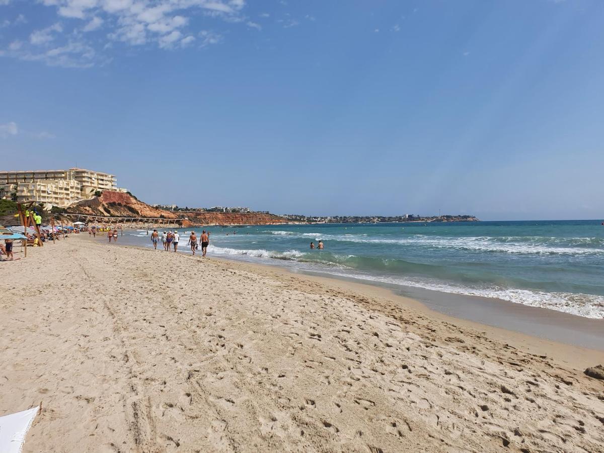 Apartment In Campoamor Overlooking The Swimming Pool Extérieur photo
